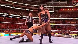 rhea ripley battles charlotte flair in a intense wrestling match at wrestlemania