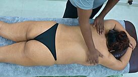 latina receives massage from black boy