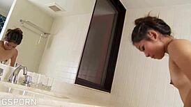 thai beauty teases hairy pussy in steamy bath