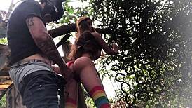 In the backyard, fucking the redhead's ass like a sex toy.