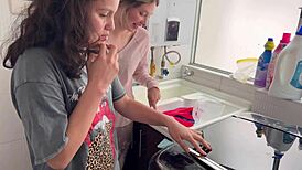 I watch two teens tribbing passionately in the kitchen