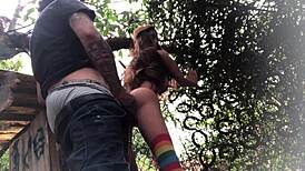 In the backyard, fucking the redhead's ass like a sex toy.