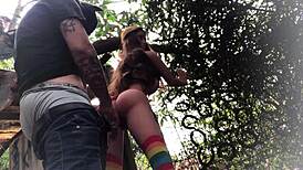 In the backyard, fucking the redhead's ass like a sex toy.