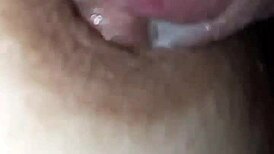 The nipple glistens with saliva on the glans