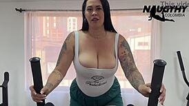 horny milf with big natural tits masturbates alone in the gym using toys for gaping