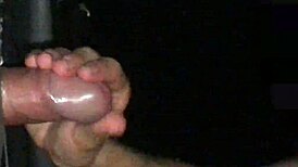 wet handjob through glory hole, milking cum from source