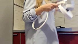 Hot girl cleans the stove, shows her big ass and tits, then masturbates passionately