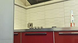 Hot girl cleans the stove, shows her big ass and tits, then masturbates passionately