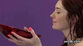 hey check out this babe getting her pussy filled with warm piss and cumming