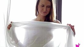 Blonde hottie Janna O strips and teases her perky tits.