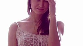 Blonde hottie Janna O strips and teases her perky tits.