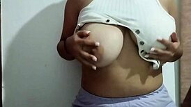 Milf massages her big natural tits with pleasure in a real homemade video