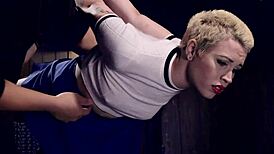 blonde slave with gas mask gets choked and whipped in bondage