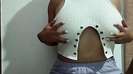 Milf massages her big natural tits with pleasure in a real homemade video