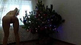 bitch dancing around the christmas tree showing tits and ass