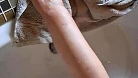 washing dirty feet in the bathtub