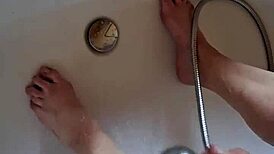 washing dirty feet in the bathtub