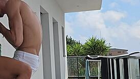 Intimate moment with tommy cabrio on the balcony observed by neighbors