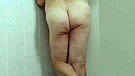 trans woman in crossdressing shows off barefoot feet and sexy ass