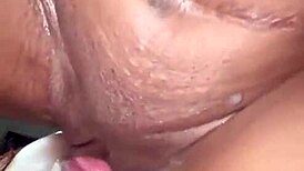 Sexy black girl licks pussy passionately.