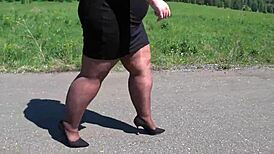mature bbw in nylon pantyhose and high heels walks public road for foot fetish