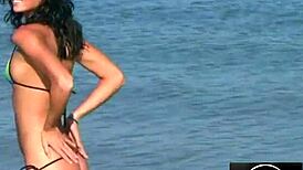 jessica dances sensually in bikini on beach, teasing with erotic moves