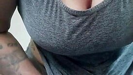 the kinky fuckers tattooed brunette fucks a dildo with her big tits bouncing