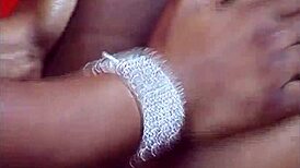 Ebony lesbians in bikinis kiss and finger in intimate scene