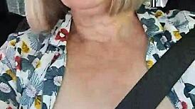 Naughty housewife takes homemade selfie with exposed tits in the car.