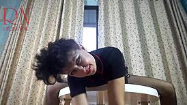 Hey, check out this nice lady stripping in pantyhose and heels at the round table