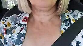 Naughty housewife takes homemade selfie with exposed tits in the car.
