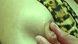 She's flashing with wild horniness, inviting cum on her tits and armpits in this fetish display