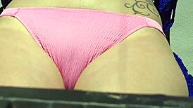 Blonde rubs suncream on tits while sunbathing publicly, flashing neighbors 😏