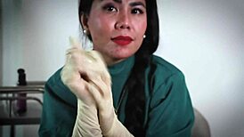 nurse in hospital uses latex gloves for fetish play