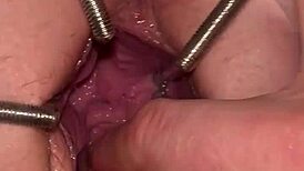 fist queen's pussy stretched with metal ring