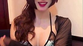 Beautiful Asian shemale masturbates her ass while streaming live