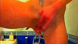 Tattooed Model Fingers Pussy With Glass Dildo In Bathroom