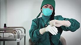 nurse in hospital uses latex gloves for fetish play