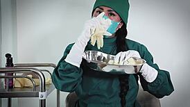 nurse in hospital uses latex gloves for fetish play
