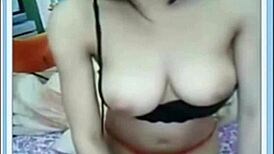 Asian amateur with big tits performs solo masturbation.