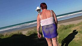 Kiwi trashy milf walks in see-through clothes at the beach, then gets creampie fucked in plain view trailer.