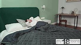 Sexy flexible teen masturbates her wet pussy while loving her panties.