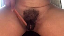 Ebony milf shows hairy pussy and big clit in solo close-up