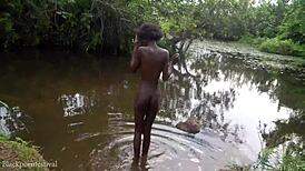 do you want to watch this skinny african girl bathing outdoors?