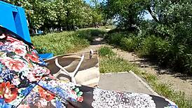 Hairy mature woman wears transparent dress outdoors