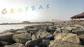 Couple having fun playing voyeur at the public bar and beach