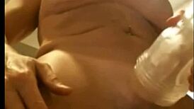 Busty tranny plays with her cock and cums