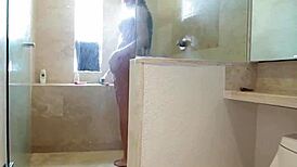 Glamorous latina transsexual passionately caresses her throbbing cock in the shower!