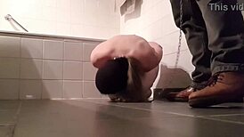 slave girl at master's feet gets toys and blowjobs in public humiliation