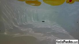 sexy nadia bathes with rubber duckies fingering her pussy